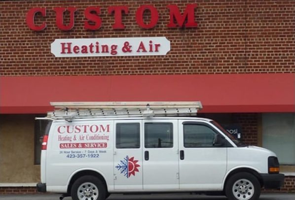 Custom Heating & Air Conditioning van outside the Church Hill shop